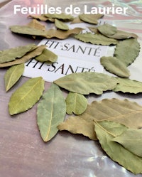 a bunch of leaves in a plastic bag with a label on it