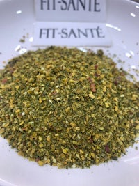 a bowl with a mix of herbs and spices