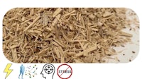 a pile of wood chips with a sign on it