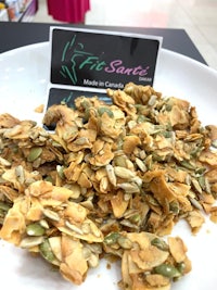 a plate of granola with seeds and nuts on it